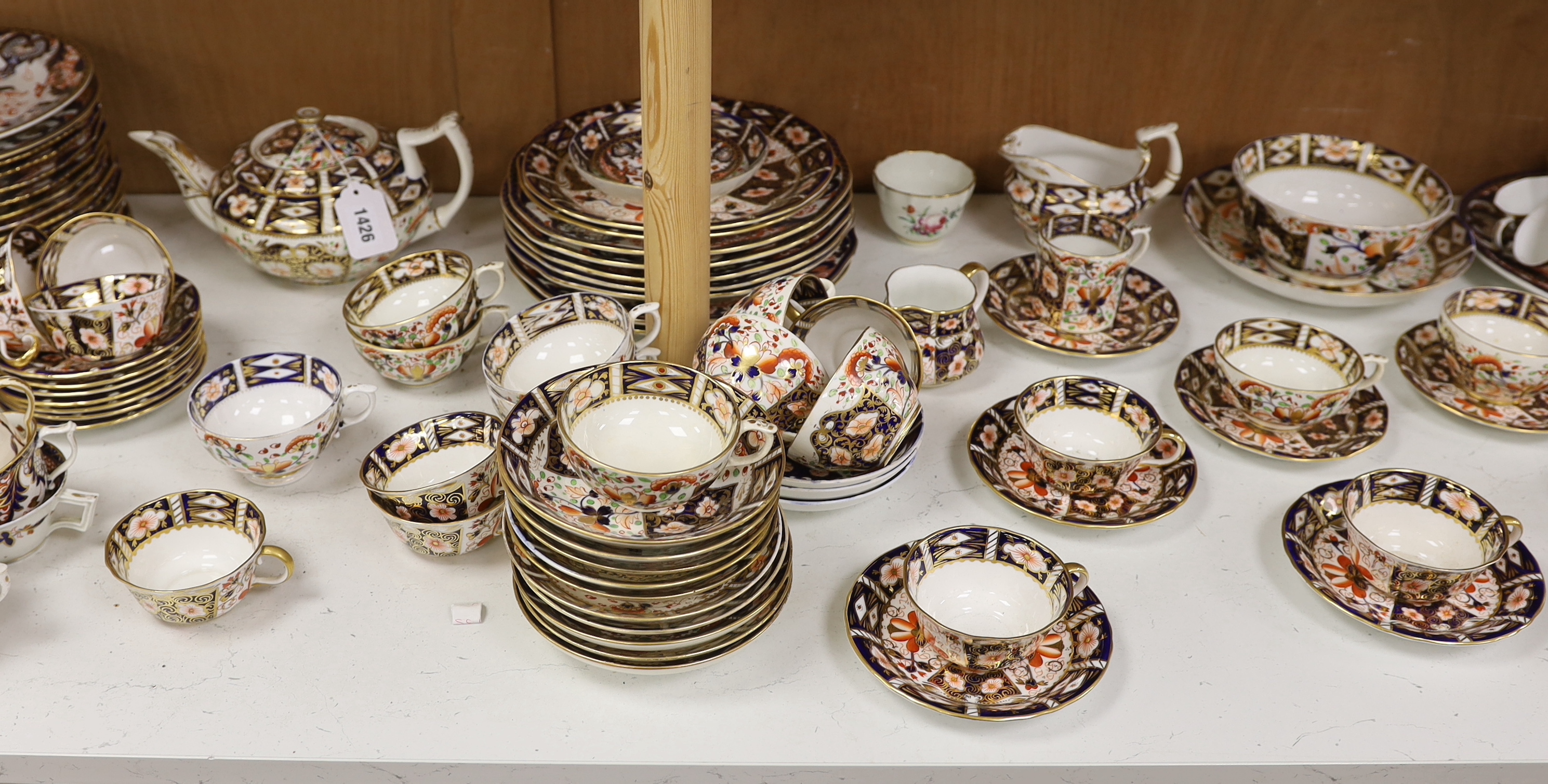 A Collection of Bloor period to Royal Crown Derby Imari pattern dinner and tea ware including dinner plates, cup and saucers and jugs, etc. largest 26cm in diameter